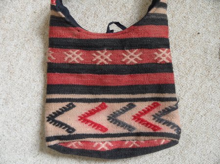 A shepherd's bag woven by nomadic tribespeople of central Anatolia in modern Turkey; a design from Kayseri/Tomarza village. The horizontal 'V' pattern represents the return flight of migratory cranes, symbolic of good news, while the cross-hatched symbols are the nests of 'holy birds'. (Picture: Simon Crook. I'm grateful to Mr Bilal Olgun for explaining the symbolism woven into this bag).